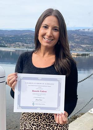 Danielle Lafleur holding 2024 Student Poster Outstanding Research Award